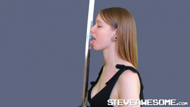 Fitness Girl Licks Sword & Wanks It
