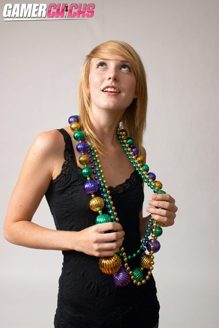 Molly donned some Mardi Gras fashion accessories for us while in the Gamer Chick laboratories and demonstrated proper necklace acquisition techniques. Steve Awesome was more than happy to document the process. Molly flashes her gorgeous 32A boobies for the camera repeatedly in the full set. Enjoy these small samples because there's more where this came from!